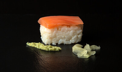 Smoked Salmon Nigiri sushi with wasabi and pickled ginger