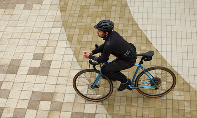 Gravel cyclist, top view. Warm clothes for cycling for autumn and winter.