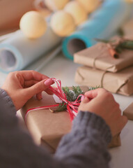 Hands of woman decorating christmas gift box. Hands of woman. Christmas.