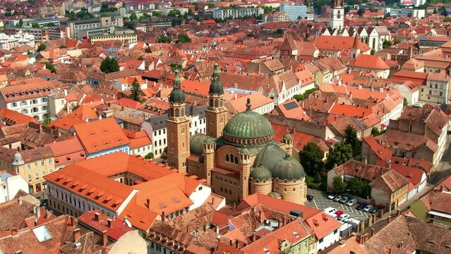 Aerial drone view of Cluj centre, Romania. Cityscape, roads with cars, old buildings, Saint Michael Church and Holy Trinity Cathedral