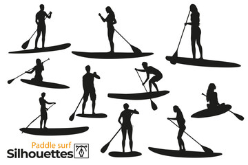 Isolated silhouettes of paddle surfers in the sea. - obrazy, fototapety, plakaty