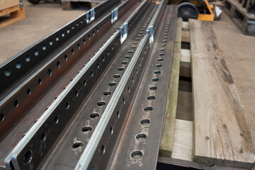 Obraz premium Bent plates, many drilled holes