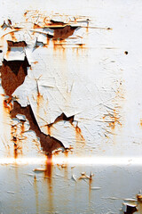Rusted white painted metal wall. Rusty metal background with streaks of rust.