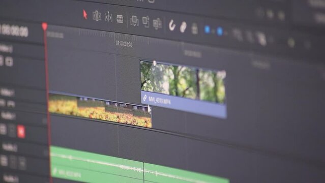 Professional video editing process for movie production with expert software to cut footage clips and mix sequences or color grading with cinematic effects and video and sound design in studio quality