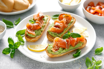 Toasts with salted salmon and avocado guacamole