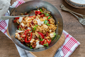Cod, chorizo and orzo pasta with roasted red peppers