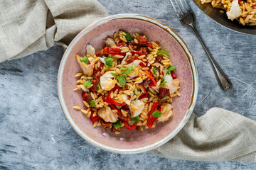 Cod, chorizo and orzo pasta with roasted red peppers