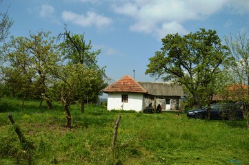 Fototapeta na wymiar an old little white house in the village