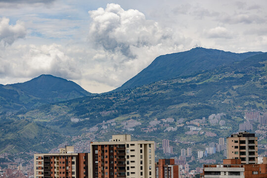 medellin colombia city cityscape with building, iconic architecture and mountains and sky with clouds