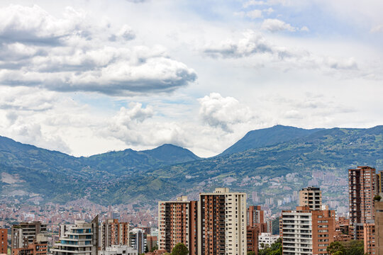 medellin colombia city cityscape with building, iconic architecture and mountains and sky with clouds