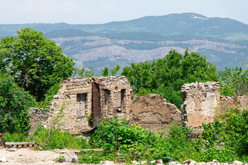 Destroyed houses during Karabakh war in Shusha city of Azerbaijan. Armenian terror in Nagorno...