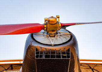 The propeller of and old airplane on its nose.