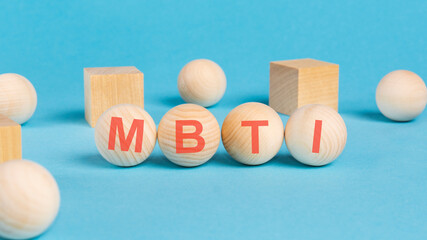 MBTI acronym, inscription on wooden balls. types of personalities concept