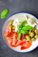 cheese platter meat plate jamon, cheese, olive meal food snack on the table copy space food background