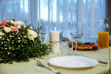 glasses on the table with dishes