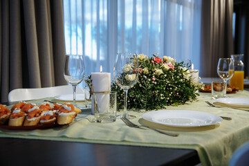 glasses on the table with dishes
