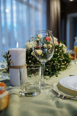 glasses on the table with dishes