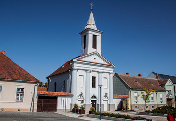 Historical Evangelical Church in the old town of Sárvár, Hungary, Europe. With its white-painted walls and harmonious proportions, it's an example of the Classicist church architecture of Transdanubia