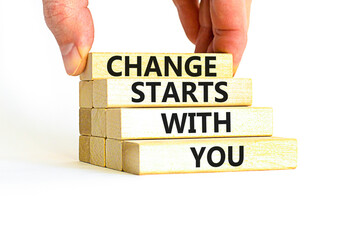 Change starts with you symbol. Concept words Change starts with you on wooden blocks on a beautiful white table white background. Businessman hand. Business motivational change starts with you concept