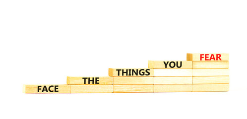 Face the things you fear symbol. Concept words Face the things you fear on wooden blocks on a...