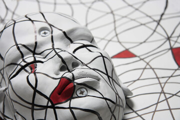 Female face portrait. Sculpture of white face with closed eyes. Abstract geometric pattern, inspired by the painter Mondrian.