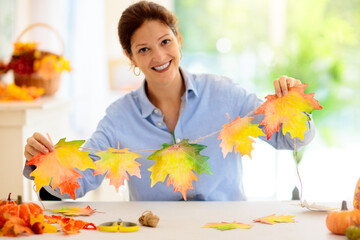 Autumn home decoration. Family decorating house.