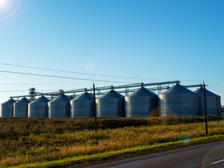 Flat bottom aluminum silos for grain storage. Grain elevator. Food crisis