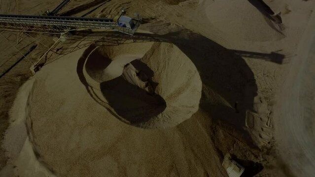 Aerial view of sandpit and factory plant producing sand materials for construction industry.