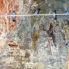 frescoes on the walls of an abandoned temple