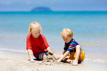 Kids playing on beach. Children play at sea.