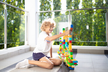 Child playing on home balcony