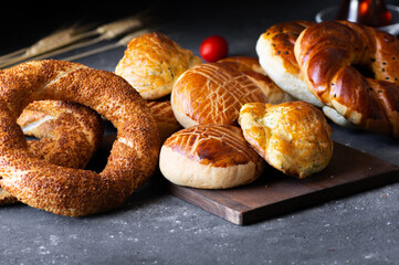 Traditional Turkish pastry concept,  pogaca , bagel,  on rustic table, famous bakery product