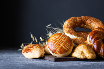 Traditional Turkish pastry concept,  pogaca , bagel,  on rustic table, famous bakery product