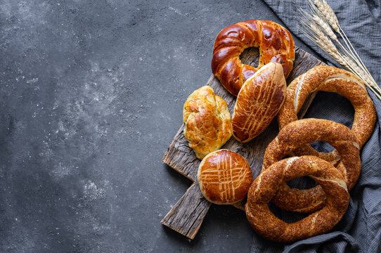 Traditional Turkish pastry concept,  pogaca , bagel,  on rustic table, famous bakery product