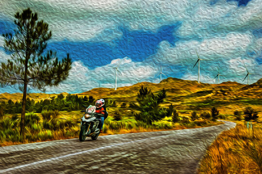 Motorcyclist passing by a paved road with wind turbines over hills near Sortelha in Portugal. Oil paint filter.