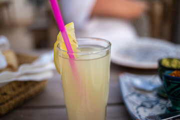Fresh yummy lemonade served on a drinking glass in a restaurant