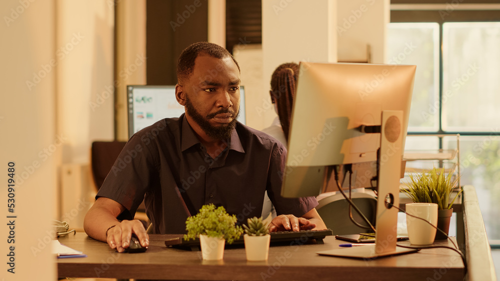 Poster african american man planning web presentation on computer, using online research information to cre