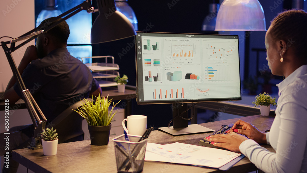 Poster office worker analyzing research data on computer network, using online information to create busine