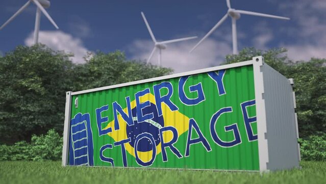 Industrial battery with flag of Brazil and ENERGY STORAGE text at wind turbines. Green power concept. 3d animation