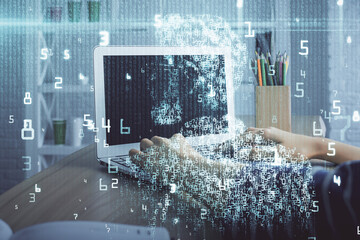 Double exposure of woman hands working on computer and data theme hologram drawing. Tech concept.