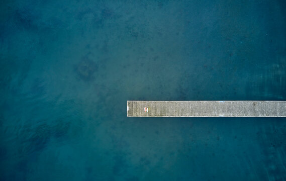 Pier in blue sea water