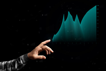 male hand in a plaid shirt shows a holographic graph on a black background, concept