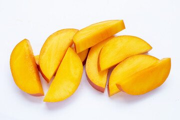Mango fruit slices on white background.