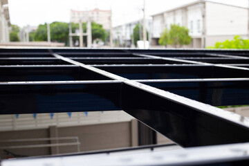 Fototapeta na wymiar Steel roof structure. Build a room addition