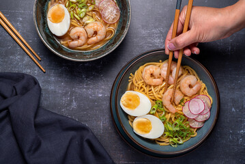 Food photography of ramen soup, noodles, prawn, egg