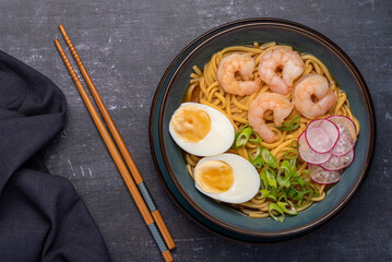 Food photography of ramen soup, noodles, prawn, egg