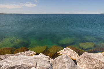 Rocks of a breakwater in the lake