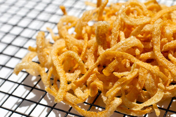 Crispy pork rinds or pork snack.