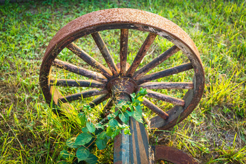 19th c Wooden Wagon Wheel with Rusted iron Tire - obrazy, fototapety, plakaty