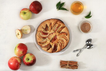 Kitchen background with apple pie, honey, apples, spices, cozy warm concept, hello autumn, hygge...